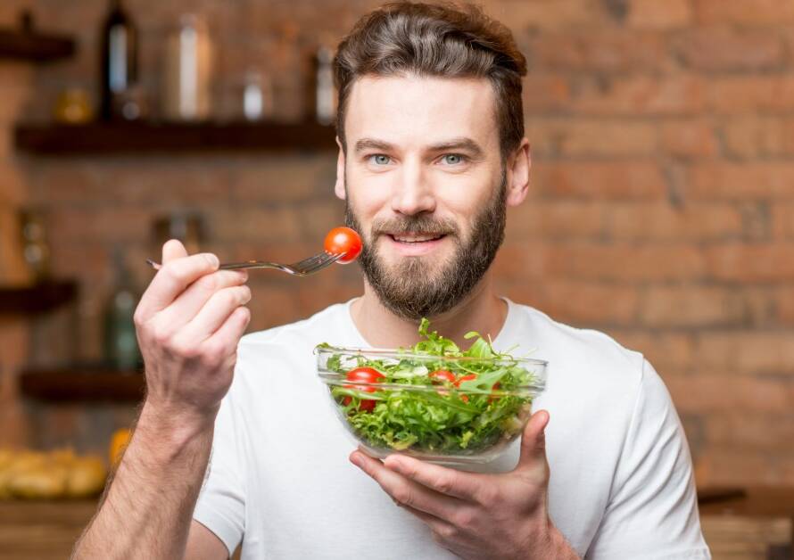 confident man preparing a nutrient-rich meal